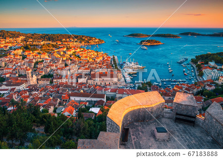 Majestic medieval Hvar town with amazing harbor at sunset, Croatia 67183888