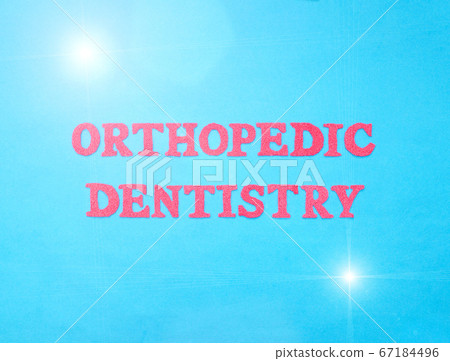 The word orthopedic dentistry in red letters on a blue background. The concept of the section of dentistry dealing with prosthetics in the oral cavity, orthodontic The word orthopedic dentistry in red letters on a blue background. The concept of the section of dentistry dealing with prosthetics in the oral cavity, orthodontic 67184496