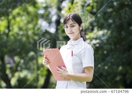 A lady in white A lady in white 67184796