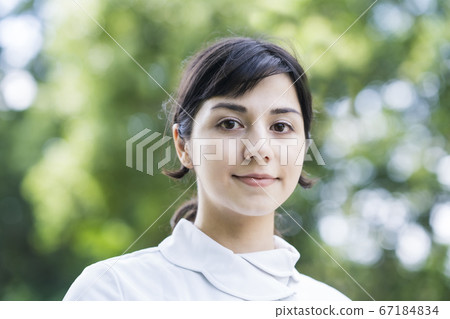 A lady in white A lady in white 67184834