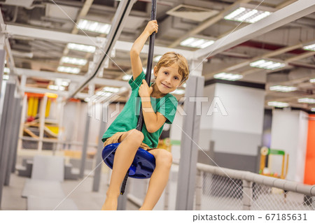 The boy has fun in an indoor playground 67185631