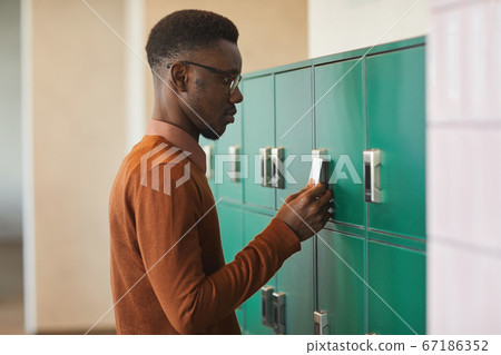 African-American Student Opening Locker African-American Student Opening Locker 67186352