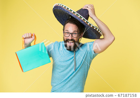 Mexican shopping. Man smiling face in sombrero hat Mexican shopping. Man smiling face in sombrero hat 67187158