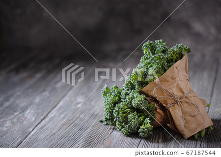 Two bunch of broccolini. 67187544