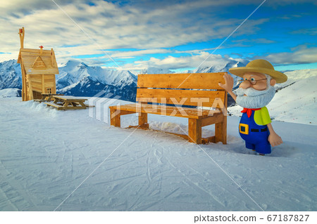 Mountain rest area with wooden benches in the French Alps 67187827