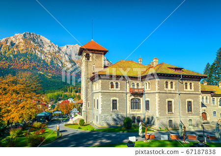 Cantacuzino castle with garden and Bucegi mountains in background, Romania 67187838