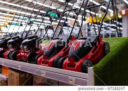 MINSK, BELARUS - April 01, 2020: hardware store with a large selection of lawn mowers 67188247