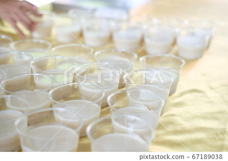 soy milk pudding in plastic cup. vegan dessert soy milk pudding in plastic cup. vegan dessert 67189038