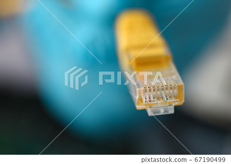 Close up of UTP internet yellow cable Close up of UTP internet yellow cable 67190499