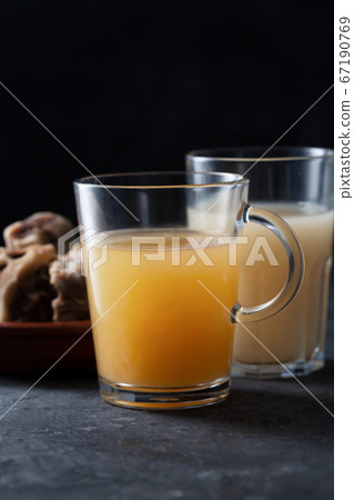 Two types of Homemade Beef Bone Broth in Glasses Two types of Homemade Beef Bone Broth in Glasses 67190769