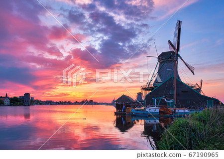Windmills at Zaanse Schans in Holland on sunset. Zaandam, Nether Windmills at Zaanse Schans in Holland on sunset. Zaandam, Nether 67190965
