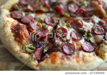 Fresh baked pizza with crusty cheese and hot tasty pepperoni ready to eat Fresh baked pizza with crusty cheese and hot tasty pepperoni ready to eat 67190999