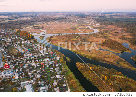 Dobrush, Gomel Region, Belarus. Aerial View Of Dobrush Cityscape Skyline In Autumn Evening. Residential District And River In Bird's-eye View Dobrush, Gomel Region, Belarus. Aerial View Of Dobrush Cityscape Skyline In Autumn Evening. Residential District And River In Bird's-eye View 67193732