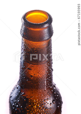 Detail of the bottleneck on a brown bottle with Detail of the bottleneck on a brown bottle with 67193993