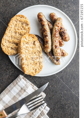 Grilled white sausages. 67195155