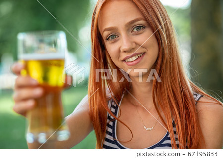 Beautiful Cute Red-hair Women Drinking Beer Beautiful Cute Red-hair Women Drinking Beer 67195833