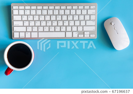 Pastel blue desk office with laptop, smartphone 67196637
