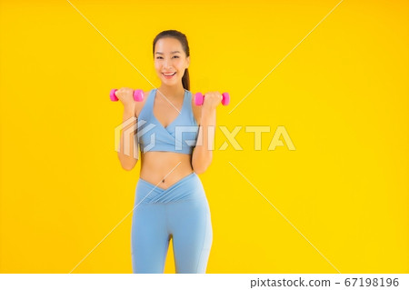 Portrait beautiful young asian woman with dumbbell and sportwear Portrait beautiful young asian woman with dumbbell and sportwear 67198196