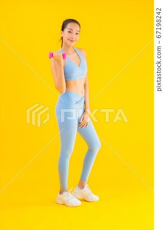 Portrait beautiful young asian woman with dumbbell and sportwear Portrait beautiful young asian woman with dumbbell and sportwear 67198242