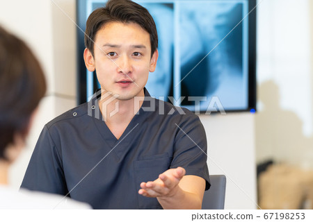 Young doctor and patient to be examined 67198253