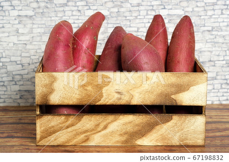 Sweet potatoes in a wooden box 67198832