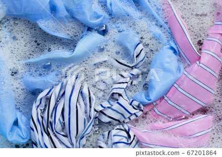 Color clothes soak in powder detergent water 67201864