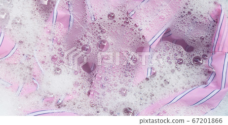 Color clothes soak in powder detergent water Color clothes soak in powder detergent water 67201866