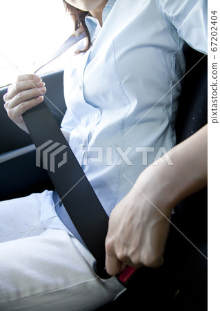 A woman with a seat belt A woman with a seat belt 67202404