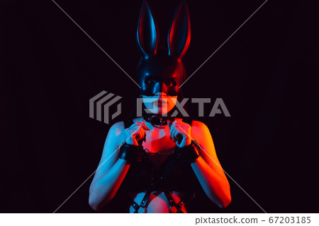 submissive girl in Bunny mask and leather harness in leather handcuffs submissive girl in Bunny mask and leather harness in leather handcuffs 67203185