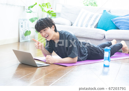 Young men training at home Young men training at home 67203791