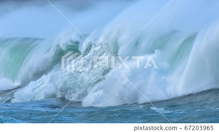 Detail of big waves in rough sea. On a cloudy day. Detail of big waves in rough sea. On a cloudy day. 67203965