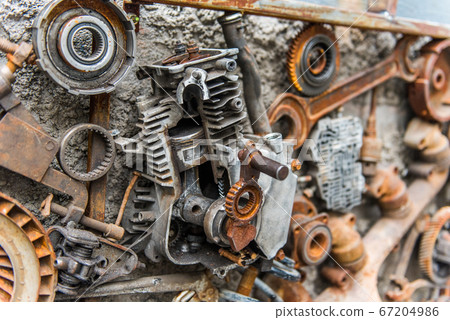 Rusted metallic car parts in garage. 67204986