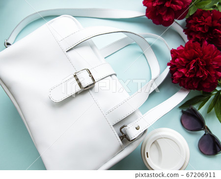 White leather bag and peony flowers 67206911