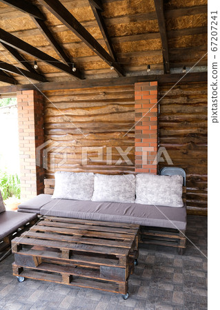 Furniture from pallets in the gazebo. Sofa and table in the barbecue lounge area. Furniture from pallets in the gazebo. Sofa and table in the barbecue lounge area. 67207241