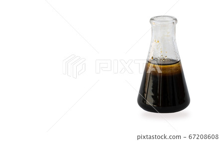 flask of oil isolated on a white background. the concept of the world oil market, falling prices.  67208608