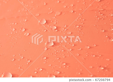 Drops of water or rain drop on orange background. 67208794
