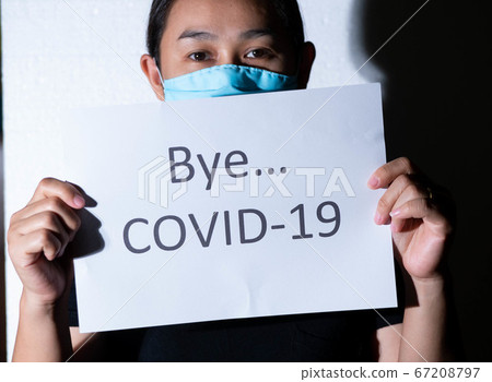 Light shining on Asian woman holding a paper 67208797