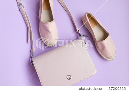 Top view of beautiful stylish shoes with a pastel Top view of beautiful stylish shoes with a pastel 67209313