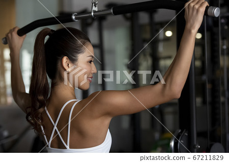 Women training at the gym Women training at the gym 67211829