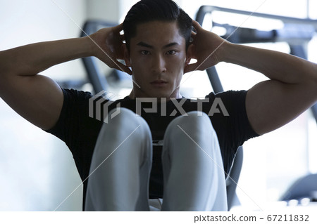 Men training in the gym 67211832