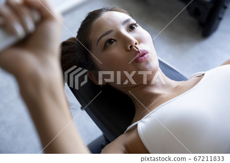 Women training at the gym 67211833