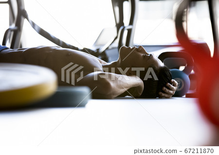 Men resting at the gym Men resting at the gym 67211870