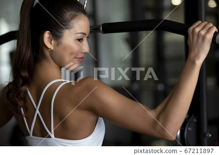 Women training at the gym Women training at the gym 67211897