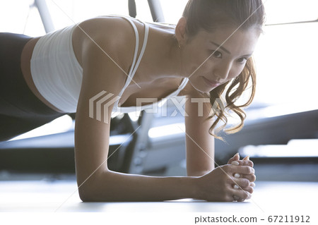 Women training at the gym Women training at the gym 67211912