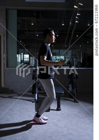 Men exercising at the gym 67211966