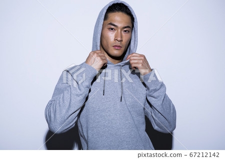 Portrait of a man wearing a hoodie Portrait of a man wearing a hoodie 67212142