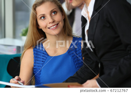 Smiling young employees having meeting in the office 67212767