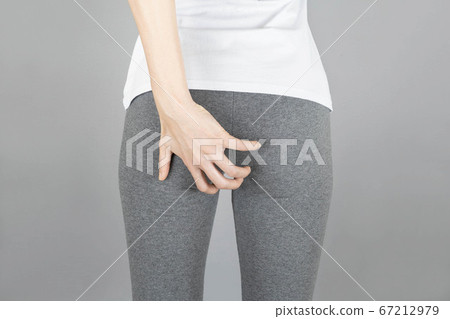 Hands holding bottom isolated on gray background,health care concept Hands holding bottom isolated on gray background,health care concept 67212979