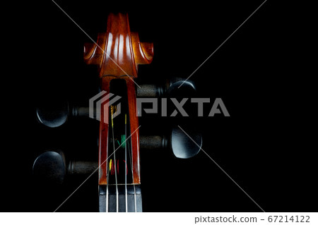 Violin Scroll on Black Background 67214122
