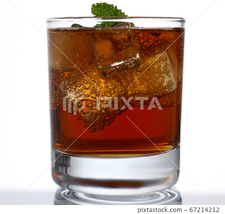 Glass of alcohol drink with ice in studio Glass of alcohol drink with ice in studio 67214212